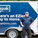 EZPak movers standing next to dolly carts and plastic bins ready to make your next Moving Services more convenient